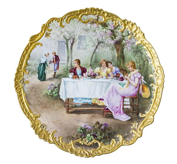 Signed Sevres Painted Porcelain Charger: Sevres painted porcelain charger, Late 19th/20th c. Beautiful gold, raised rim with four ladies having tea at a table with a man and woman looking on. A blue Sevres style mark to back. Artist signed D