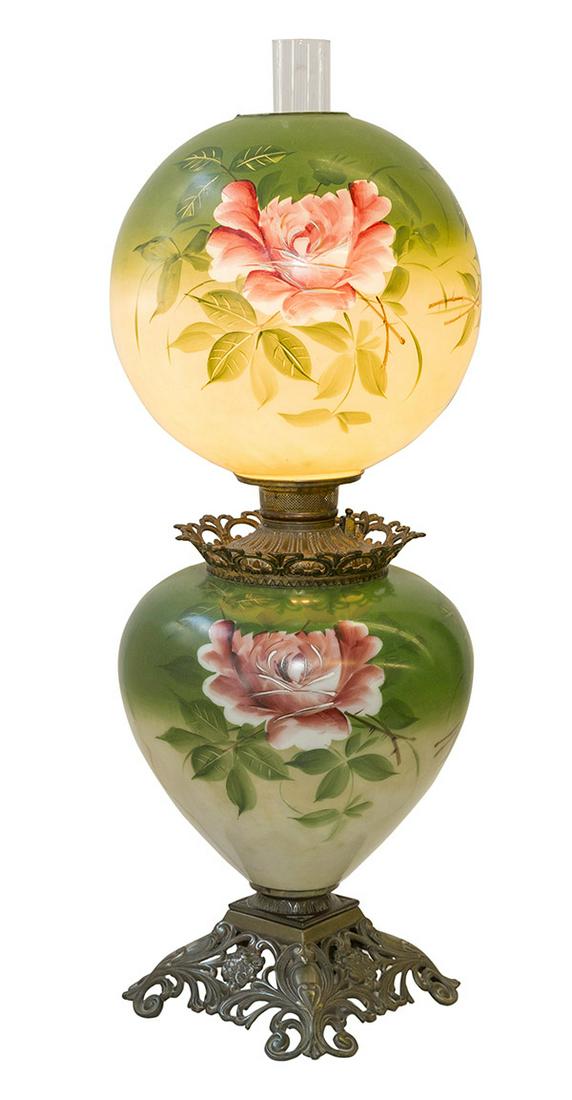 Large Green Gone With The Wind Lamp: Fine hand painted base and globe with original chimney and resting on scrolled pierced art nouveau floral base. Center support has pierced floral border with round gadroon support holding globe. 11" D