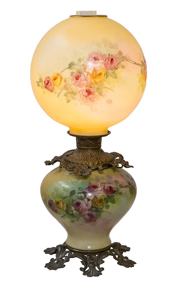 Fine Gone With The Wind Table Lamp: Bulbous form base resting on outstanding six prong base with embossed and pierced shells and scrolling acanthus leaves. Base and globe hand decorated with flowers. Center border has embossed and pierc