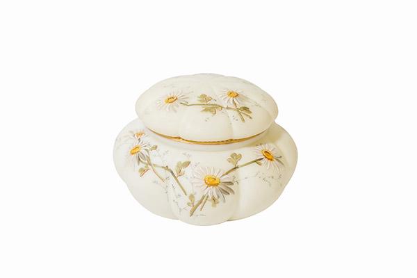 Marked Smith Brothers Enamel Daisy Box: Quilted glass lidded box decorated with enameled daises. Gold with beaded design beneath lid. 19th century. Marked with Smith Brothers trademark, a lion in a shield with Trademark printed below. 5 1/4