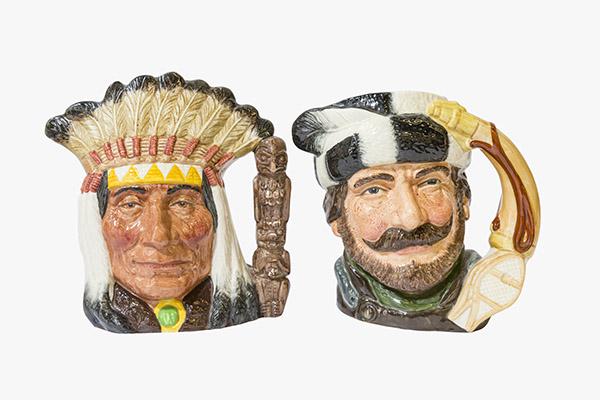 Royal Doulton Toby Mugs Trapper & North American Indian: Two Large size Royal Doulton Toby Mugs. 6 1/2" H "The Trapper" D6609 dated 1966 and "North American Indian" D6811 dated 1968. 7 1/4" H. Bright colors, clean surface and beautiful detail. Manufactures 