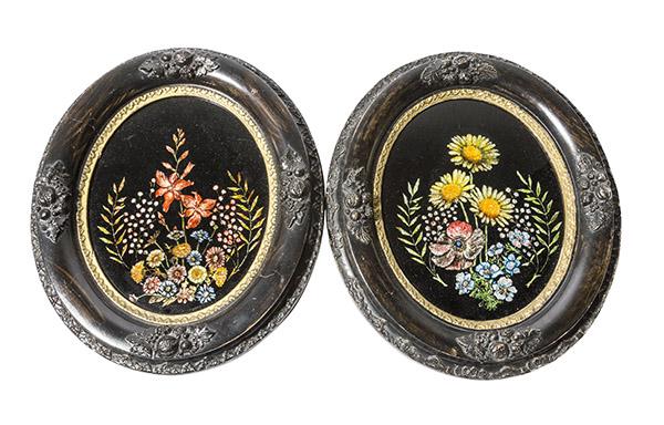 Victorian Reverse Painted & Tin Foil Portrait of: Pair of reverse painted with tin foil spray of flowers framed in oval, black frames trimmed in gold. The flowers have beautiful detailing and bright colors. Frames have raised floral motif with raised