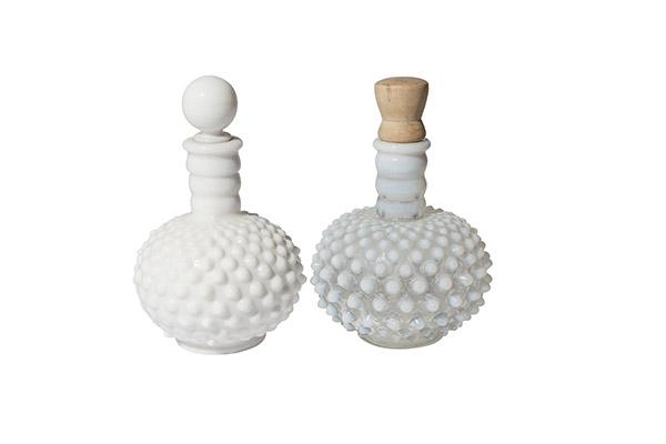 Two Hobnail Barber Cologne Bottles: Two Hobnail Barber Bottles. (1) 6" H Opalescent white hobnail with wooden stopper. (1) Milk glass hobnail bottle with milk glass stopper.