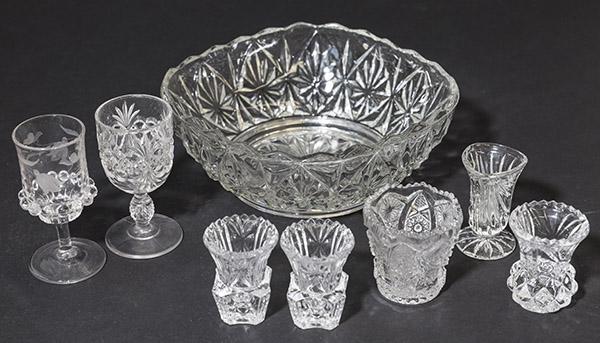 Grouping of Cut Glass and Pressed Glass: (8) Pieces of Cut or Pressed glass. (2) Wine glasses, (5) Tooth pick holders, 4 have saw tooth rims. (1) Pressed Glass Bowl