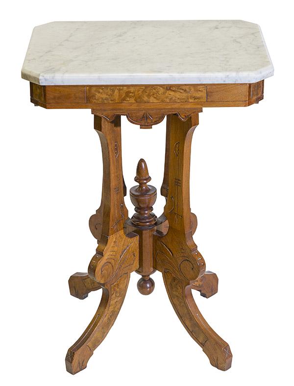 Victorian Walnut Marble Top Table Center Table: Walnut and Burled Walnut parlor table with cut corners and beveled edge white marble top. Shaped aprons resting on four carvings on sprayed legs. Center finial and ball tear drop. 21 1/4" W x 15 1/4" 