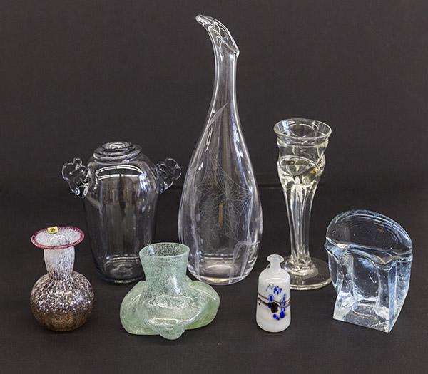 James Wayne, Kosta, Sweden Assembled Plus: Tall Kosta vase with etched spider web, unsigned squat vase and bookend. A Gusum Sweden vase, signed. Double-handled vase, signed to underside and signed "D.H.S. 83" frosted glass cabinet vase. Kosta;