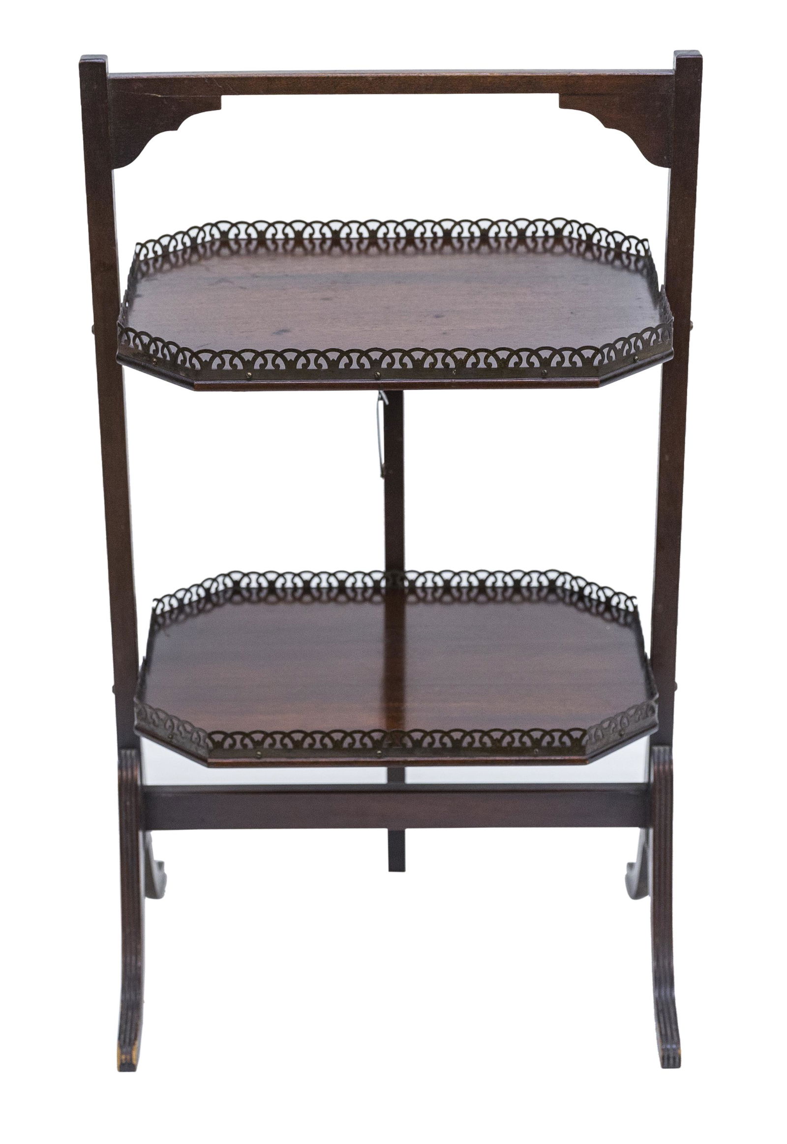 Ferguson Brothers mahogany pastry stand: Circa 1940s, 2 Tier pastry stand with Duncan-Phyfe style legs. Each tier has a pierced brass gallery. Manufactures label to underside. 18" wide x 11 3/4" deep x 30.5"