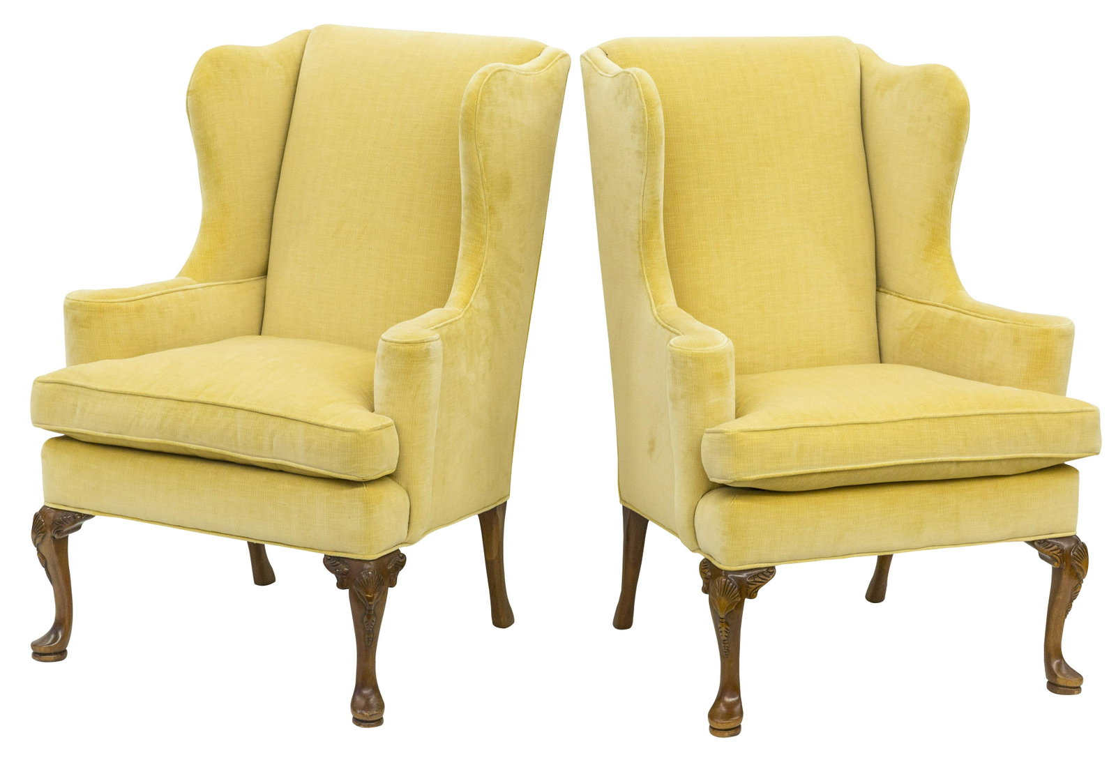 Pair of Henredon Wing Chairs: Fine curved upholstered frames over cabriole legs with carved shell knees on pad feet. No labels. These have been upholstered twice. 31W X 31D X 43 1/2H X SH: 21 1/2.