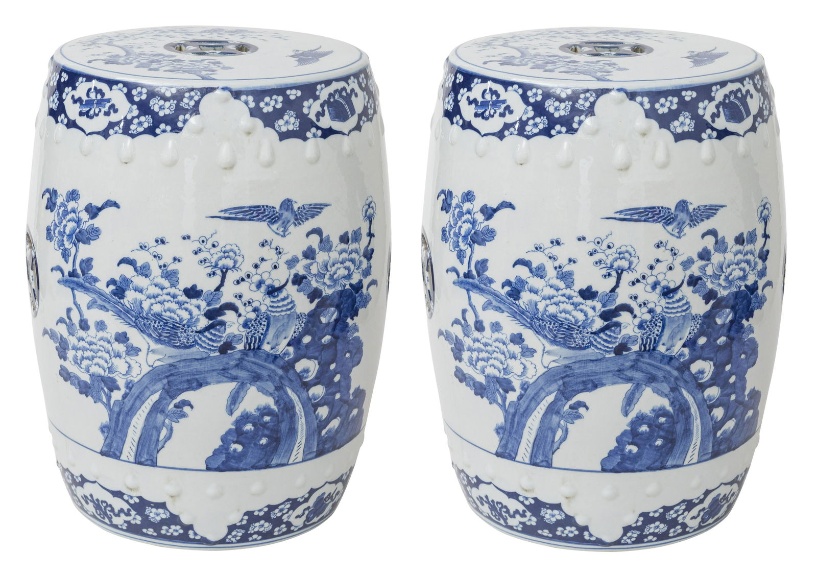 Pair of Chinese Canton Garden Seats: Pair of blue and white drum form garden seats decorated with floral motif. 13.5 dia x 17.5h