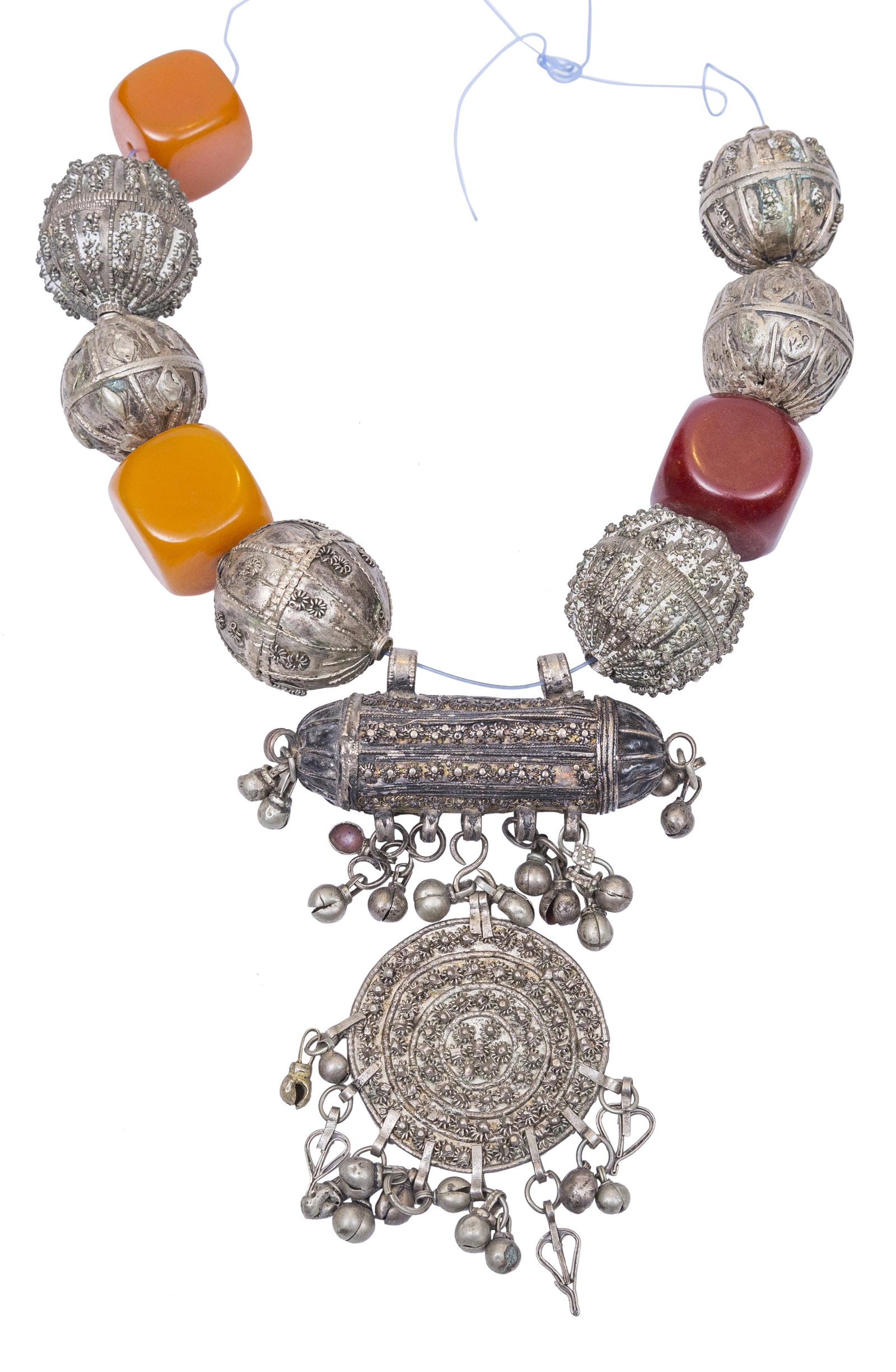 Indian (India) Silver Bakelite Necklace: Beaded necklace with six silver balls with floral motif & three backlit cube beads. Oblong pendant with floral pendant medallion with charms. 15" long