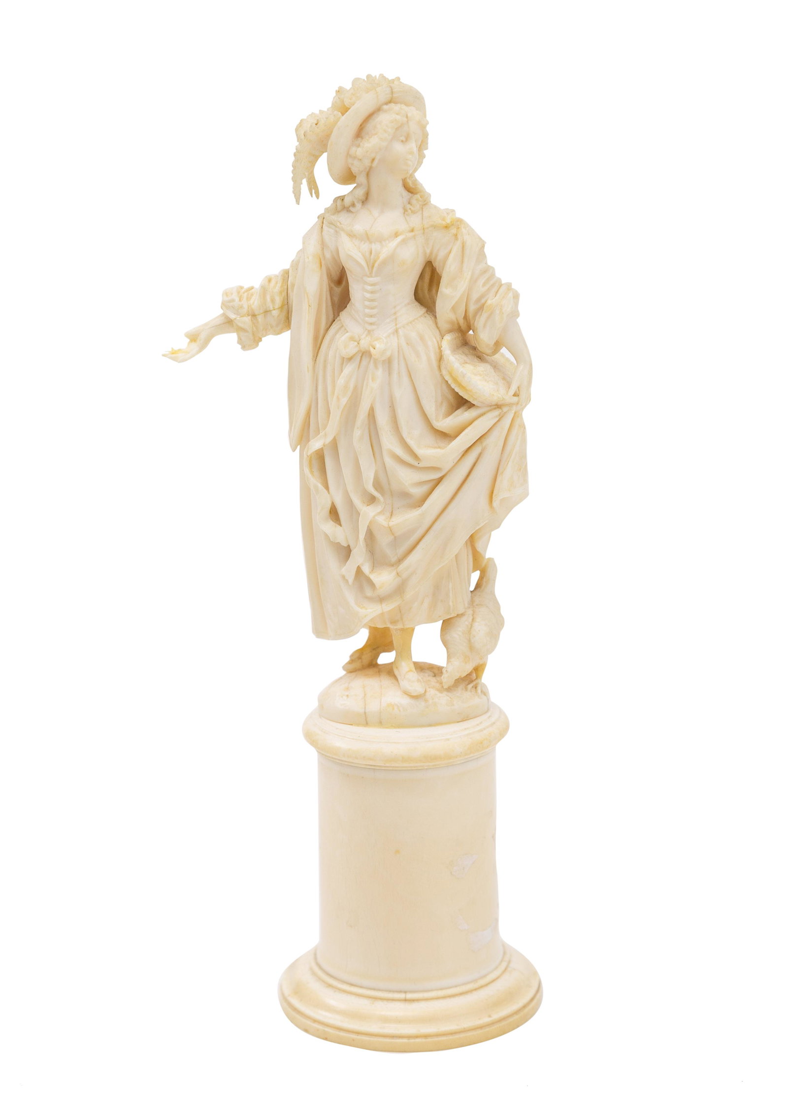 19th Century Intricately Carved French Lady: Beautifully carved French lady in fine formal dress feeling her chick. She rests on round column base, circa 1860. 3.5w x 2.5d x 9h