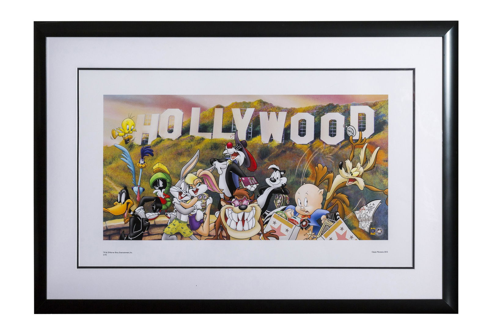 Looney Tunes Hollywood Sign Lithograph: A Warner Bros. limited edition lithograph entitled "Toons Go To Hollywood." Presented framed (image 17.5" x 31.5"; frame 26.5" x 40.5") with Classic Moments COA