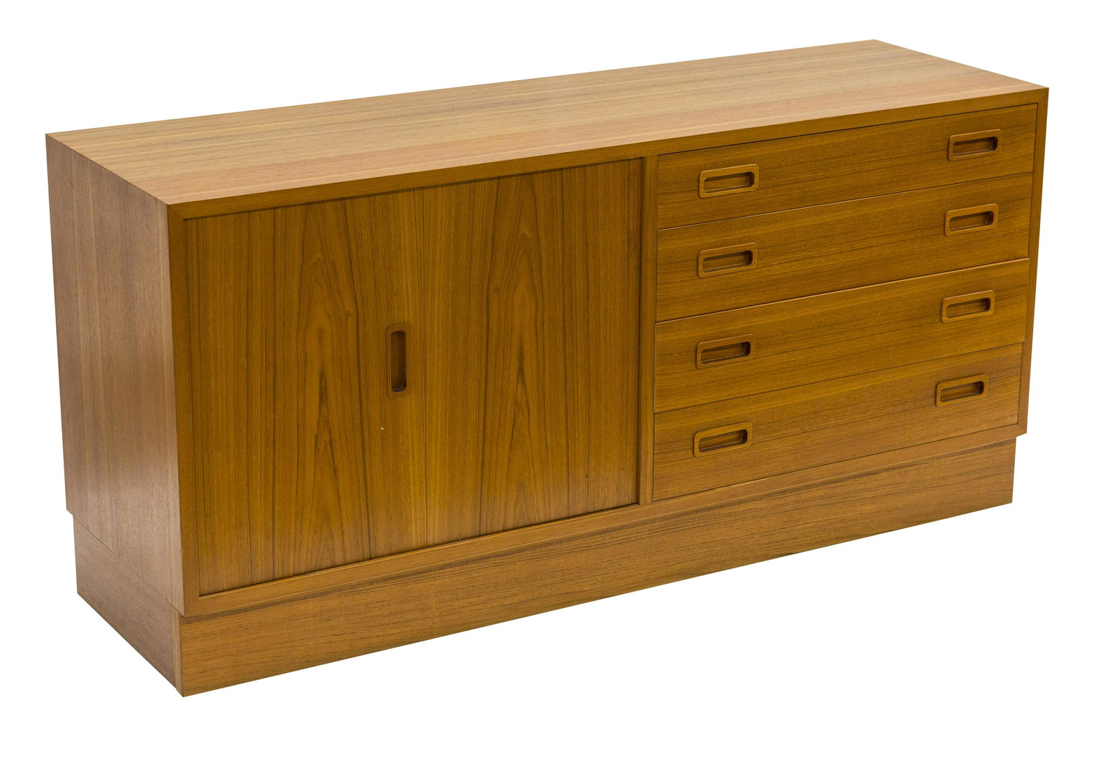 Poul Hundevad Credenza: Credenza, Hundevad, Denmark, 1970. Teak. Cabinet features four drawers and tambour door concealing shelves. 54.5w x 16.75d x 26.5h