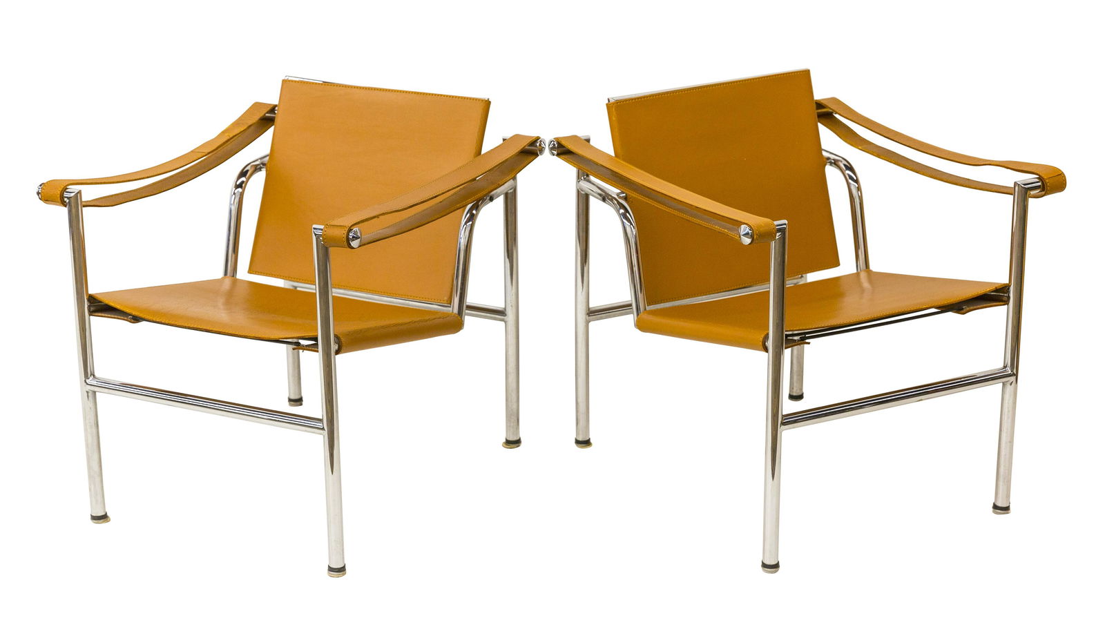 Pierre Jeanneret LC1 Chairs: Lounge chair, pair, Cassina, Switzerland, France, India, Italy. 1928/1980 chrome plated steel, leather. 23.75w x 27d x 25h SH- 15.