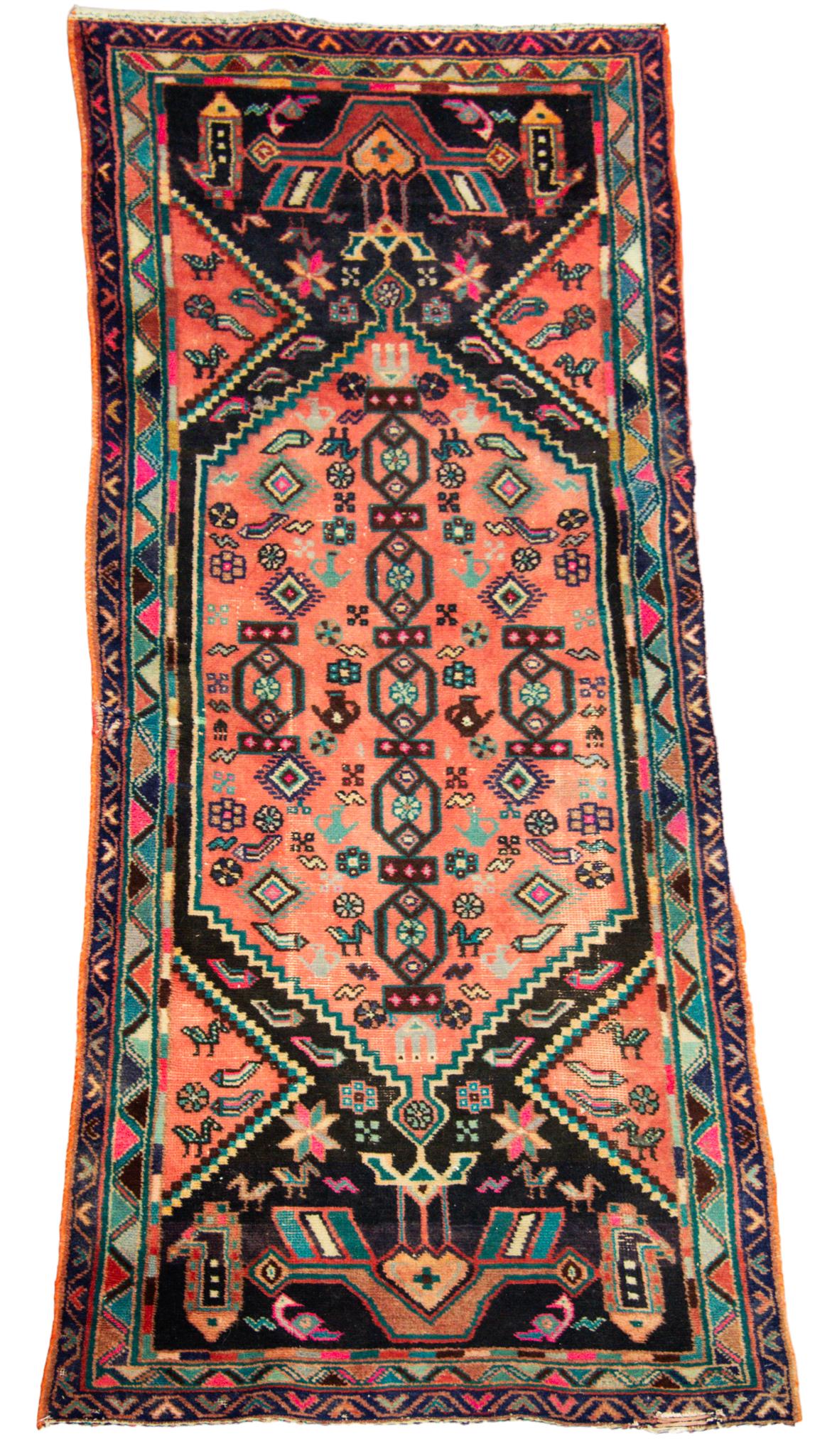 Persian Runner: Pictoral runner with pink fieldwith pastel colors and multiple borders. 2'1" x 6'11"