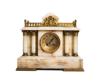 French Eight Day Marble and Bronze Mantle Clock: Clock. Fine white onyx mantle clock with gilded bronze gallery, cherub mount, clock face, Corinthian capitols bases and feet. Eight day movement with Arabic numerals and French works. #1913 and #411.