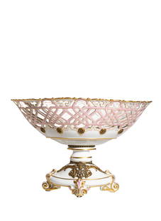 19th Century Paris Porcelain Reticulated center bowl: Circa 1880, Pierced oblong center bowl with gilded border and bronze floral medallions. Interior has pierced floral and shell mounted decoration. Bowl rests on pedestal supports with scrolled footed