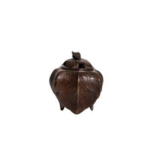 Japanese Bronze Leaf Lidded Vessel: Vessel. Bronze vessel with snail lid handle over a footed leaf body 3.5w x 3.5d x 4.375h