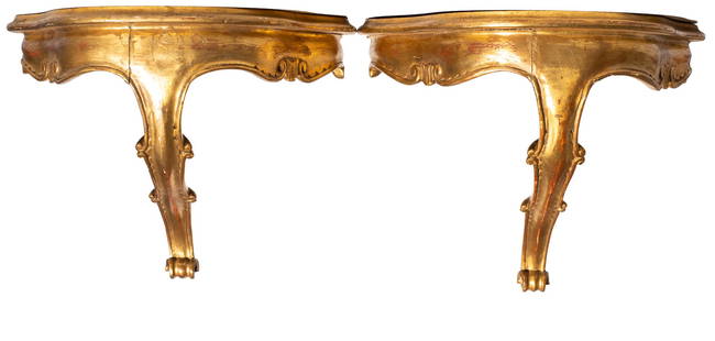 Gilded Italian Wall Shelves: Wall Shelves. Pair of scalloped front wall shelves with scalloped aprons with embossed shells. Center leg has a scalloped border with scrolled base. 15w x 9.375d x 11.25h