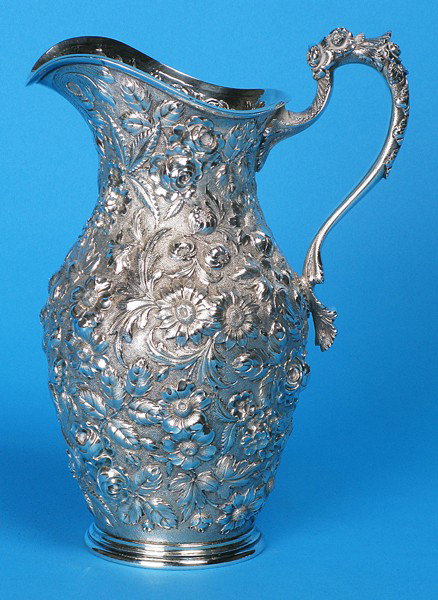 Repouse Sterling Water Pitcher: Ornate handle, Marked Loring Andrews , Co. Cincinnati, Ohio, USA, #266, 24 ozt. Estate of Annie Anderson Size: 10.5