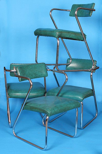 Gilbert Rohde Z Chairs: Set of four, green vinyl, chrome plated metal arm chairs, original upholstery, manufactured by Troy Sunshade, two with original labels Size: 30.5H x 20.5W x 24D