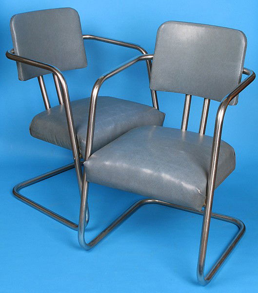 Gilbert Rohde Arm Chairs, Pair: Chrome, metal plated, tubular frame, original vinyl upholstery, original label to one arm, manufactured by Troy Sunshade Size: 32H x 20W x 23D
