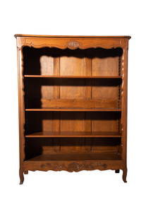 Country French Oak Bookcase: Bookcase. Top over scalloped apron with embossed shell over 3 adjustable aprons. Bookcase has paneled sides, scalloped apron with embossed shell and flowering branches resting on French legs. 48 1/2w