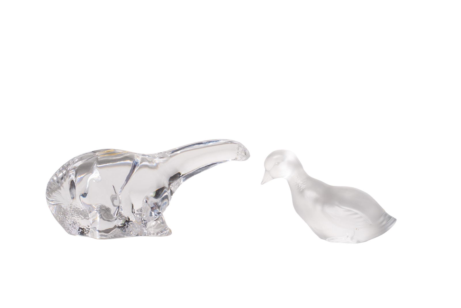 Paul Hoff Kosta Crystal Brontosaurus Plus: Crystal Dinosaur. Kosta, Sweden. Sold by museum of natural history. 6 3/4w x 3 1/2d x 3 3/8h. Baccarat French crystal duck, France 4 3/4w x 1 3/4d x 3h. Each piece has etched manufacture's marks to un