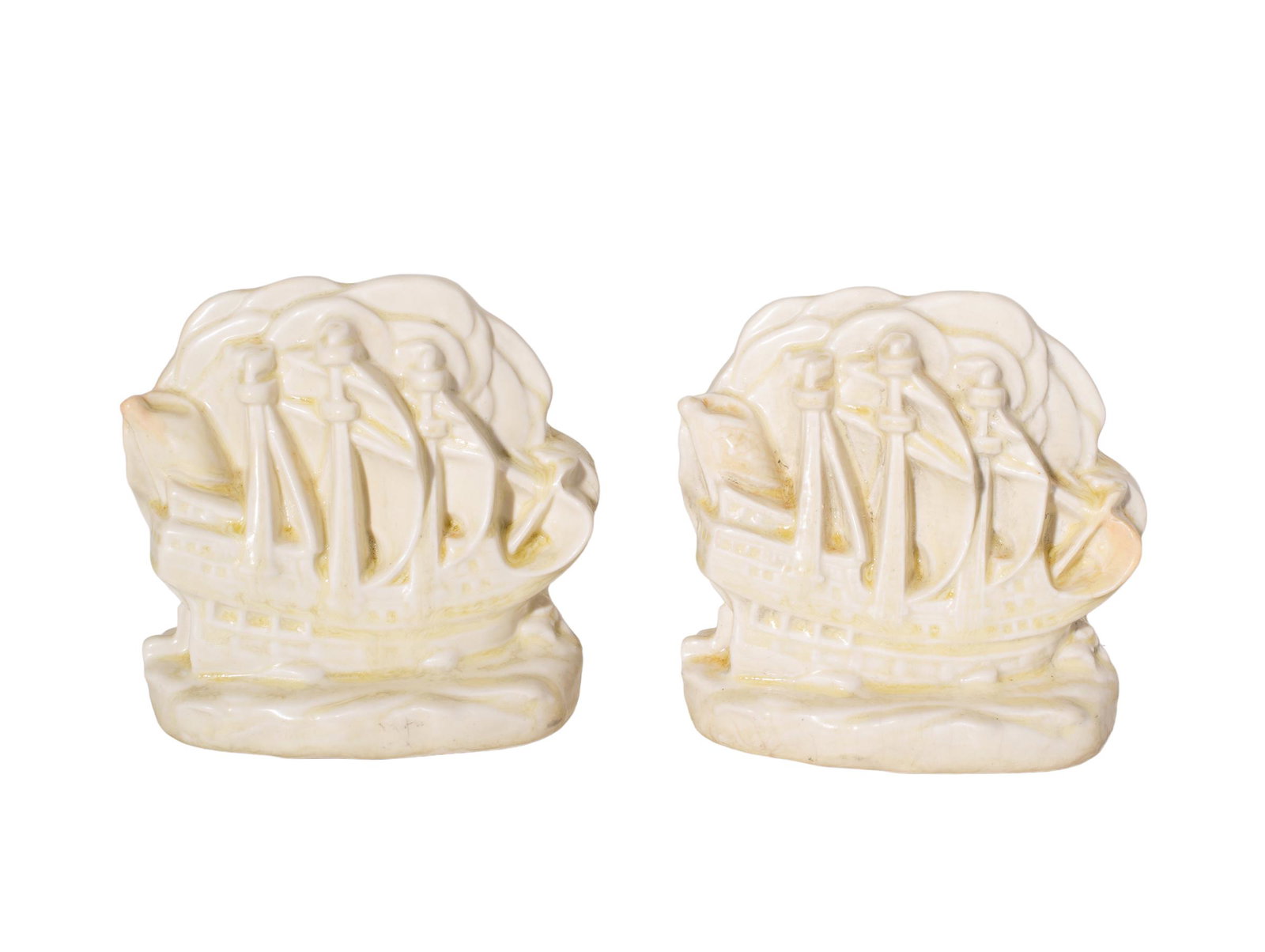 William McDonald Rookwood Potter Ship Bookends #2694: Bookends. Pair of broadside ship bookends. RP Logo, 19, McDonald molded monogram and shape # 2694. 5 3/4w x 3d x 5h.