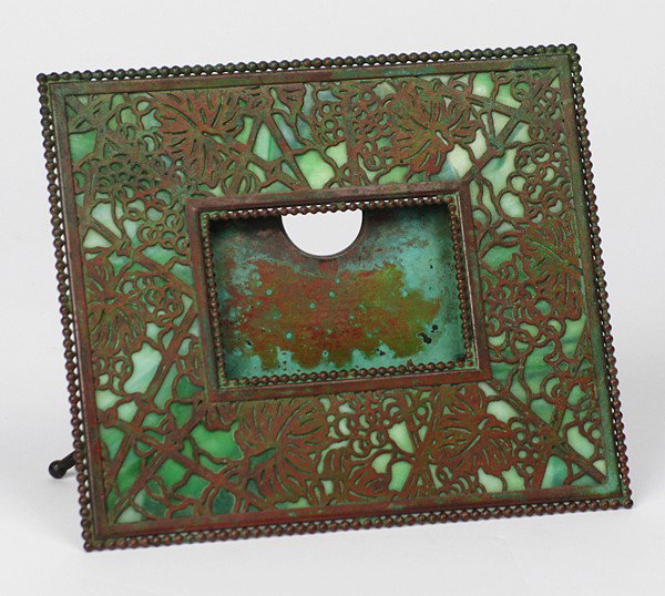 Tiffany Studio Picture Frame: Pine Cone Pattern, bronze and green slag glass with kick stand back, stamped Tiffany Studios #940 Size: 6.5 x 7.5