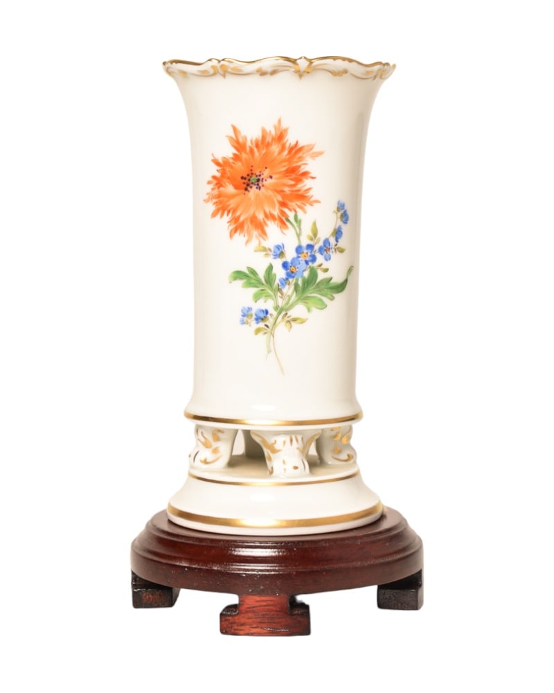 Meissen Porcelain Footed Bud Vase: Meissen Porcelain Footed Bud Vase. Scalloped rim and gilt accents. Vase has raised footed base. Manufacture's marks to underside. 2 7/8w x 5 3/4h.