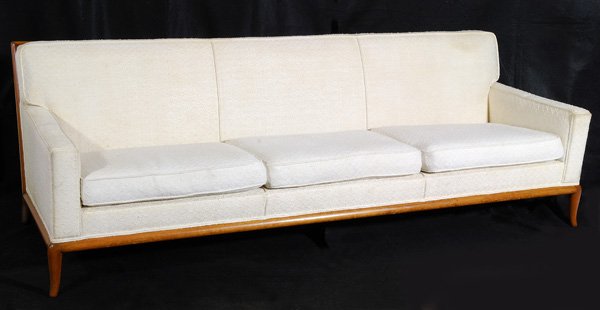 T.H. Robsjohn Gibbings Sofa: Three-seat sofa with original white upholstery on mahogany frame and tappered legs, manufactured by Widdicomb, 31"x92"x36"