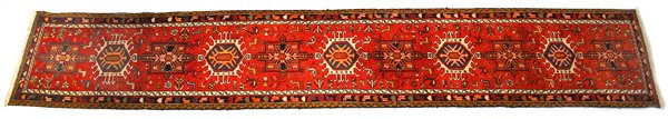 Oriental Runner: Oriental red, blue, ivory, brown, yellow field with animals, approximately 25 years old, 31" x 182"