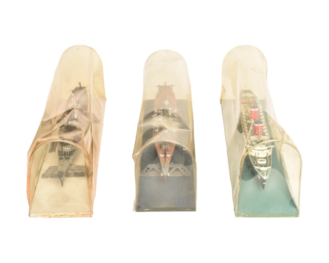 Assembled Vintage Ship Models: 3 ship models with amazing detail in original stands and custom bubble cases. U.S.S. New Jersey, U.S.S. Missouri and the U.S.S. New York. Measurement: ships 20" L, cases 23-1/2" W x 5" D x 7-1/8" H.