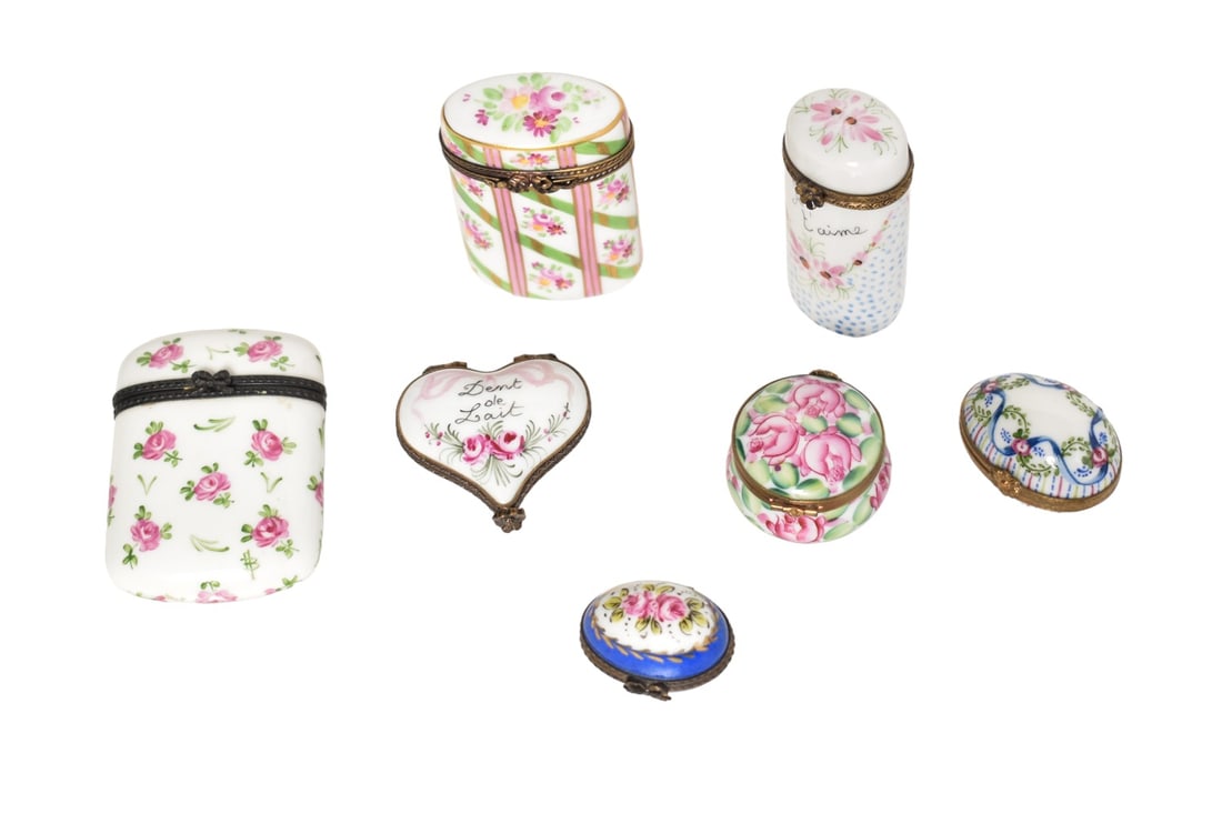 Assembled Limoges Porcelain Pill Boxes Plus: Assembled Limoges Porcelain Pill Boxes Plus. 7 total. 4 pill boxes, 2 trinket boxes and one match safe. All have hinged lids. Manufacture's mark to underside with exception of match safe. 2w x 1/2d x