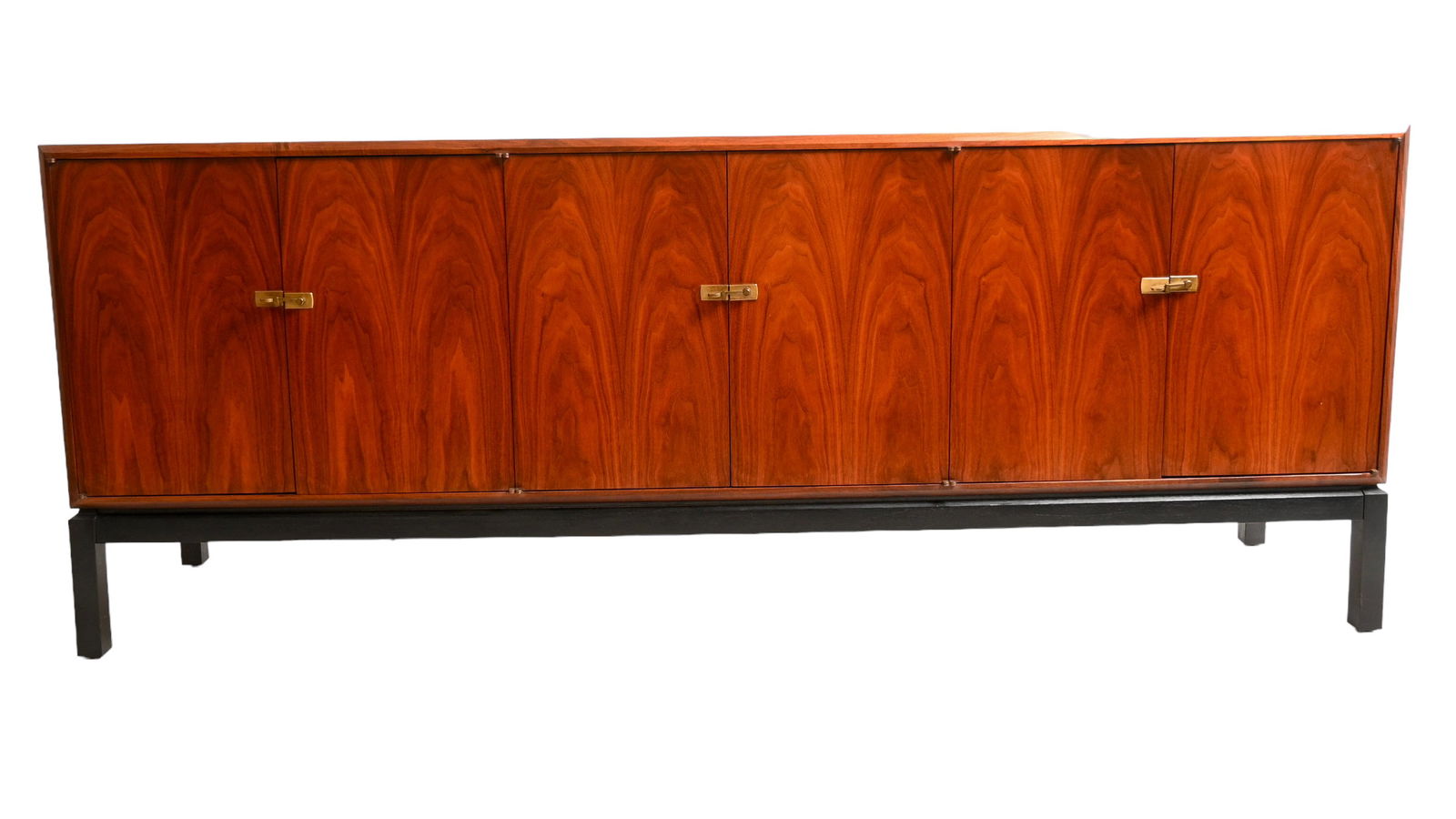 Jack Cartwright Credenza: Jack Cartwright Credenza. Founders. USA. 1964. Cabinet features 6 doors with interior shelves and three drawers to center. Walnut, ebonized walnut and brass. 77 3/4w x 18d x 30h.