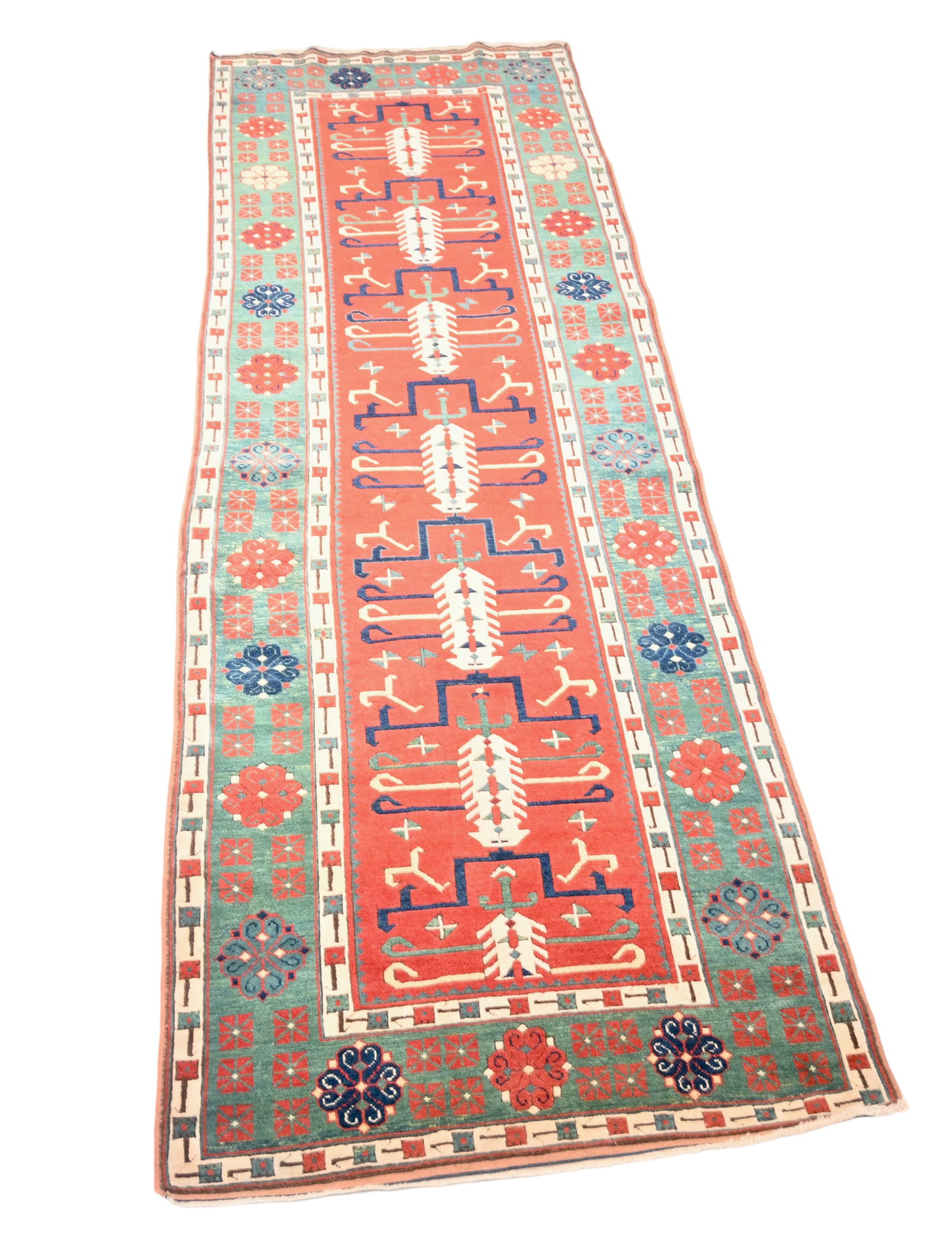Persian Rug: All over garden design over a tomato red field. Multi layer borders. 3'5" x 9'7". Proceeds from this lot to benefit The Ray of Hope Foundation for Brain Cancer.