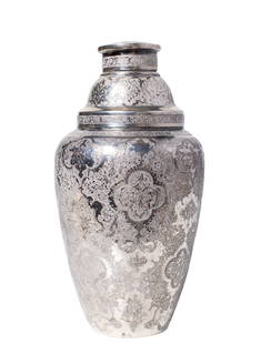 Antique Persian Silver Cocktail Shaker: Antique Persian Silver Cocktail Shaker, circa 1920s, with chased foliate design with scrolls and cartouches with Islamic motifs. Removable lid and pierced strainer. Marked to underside with makers mar