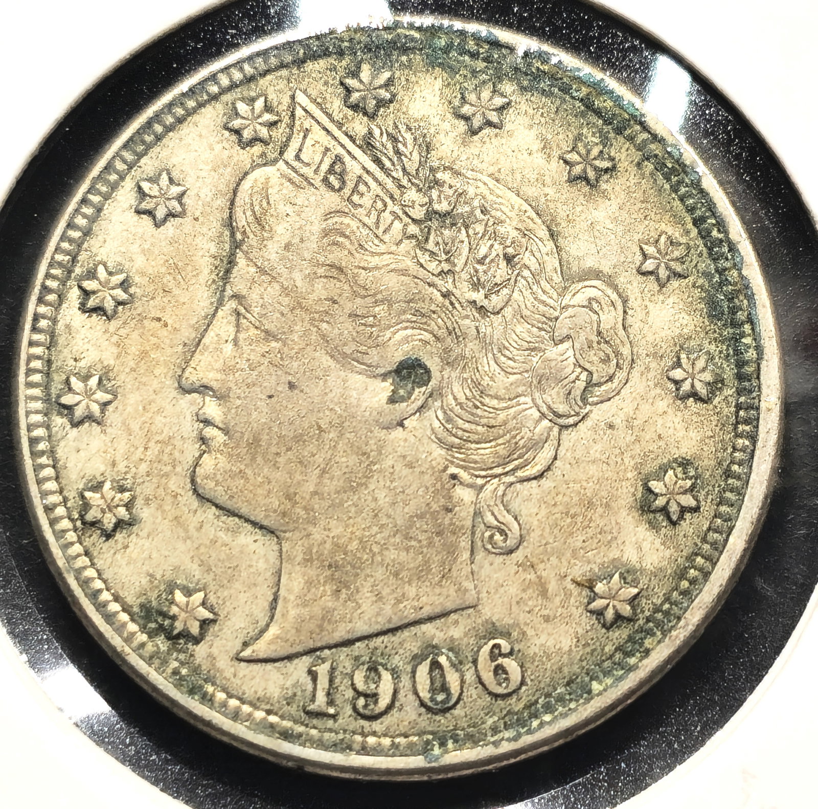 1906 Liberty Head "V" Nickel Coin Grease Error Coin: U.S. 1906 Liberty Head "V" 5c nickel in AU condition. With grease error on reverse at 7 o'clock on wreath.
