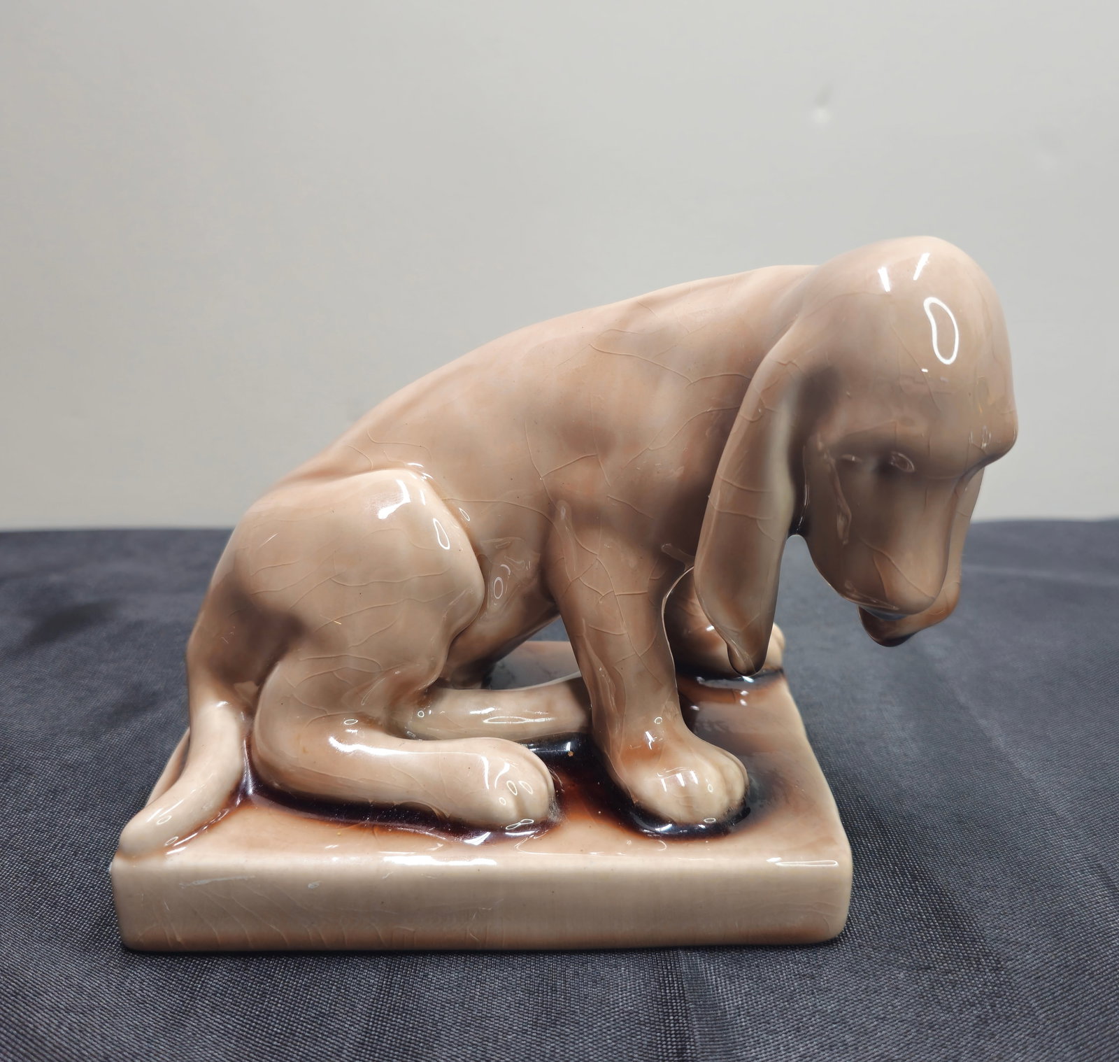 Rookwood Pottery Dog Bookend, #2998: Rookwood pottery dog bookend #2998 dated 1948. Glazed in coffee brown glaze. 6"w x 3 5/8"d x 4 3/4"h
