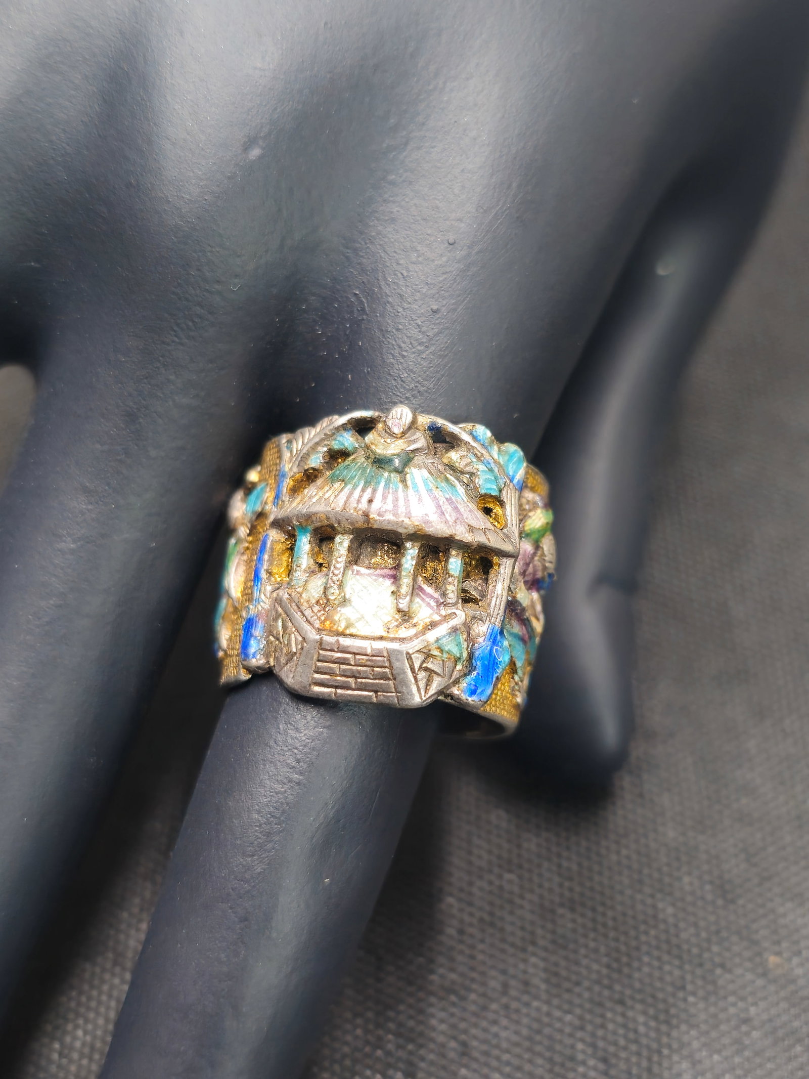 Signed Chinese Sterling & Enamel Ring: Singed Chinese sterling and enamel ring decorated with figures and pagoda. Gold wash and enamel over sterling. Weight- 9.4 ozt.