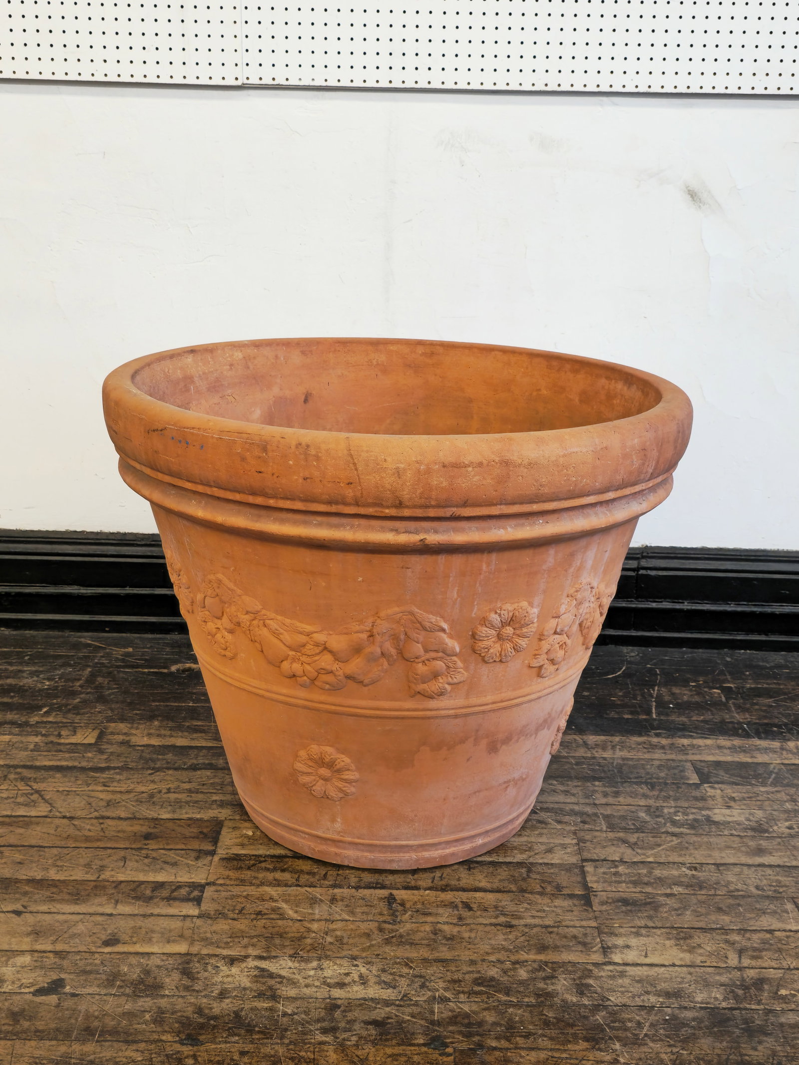 Monumental Italian Terracotta Planter: Monumental Italian Terracotta Planter. High relief floral design to border. 35 1/2 dia x 28h. Provenance; The Beth & J. Karp Collection, Indian Hill, Ohio.