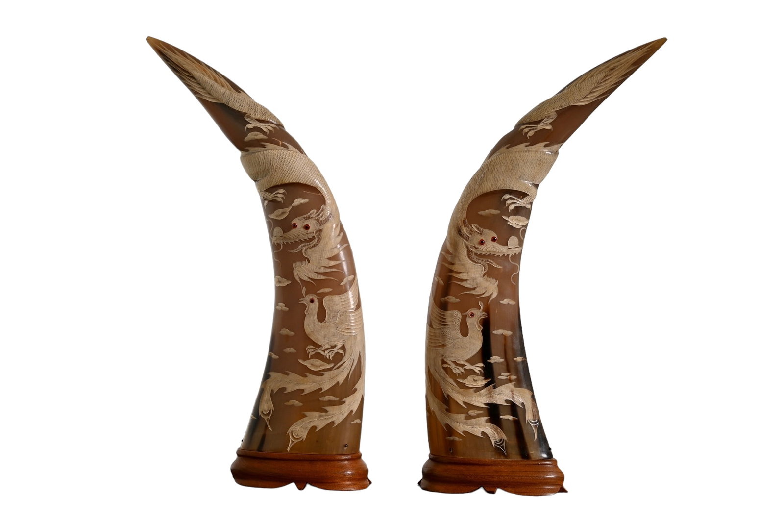 Chinese Carved Buffalo Horn with Dragon & Phoenix motif: Chinese Carved Buffalo Horn with Dragon & Phoenix motif. 20th century. Mounted on teak wood bases. 9 1/2w x 3 1/2d x 17 1/2h