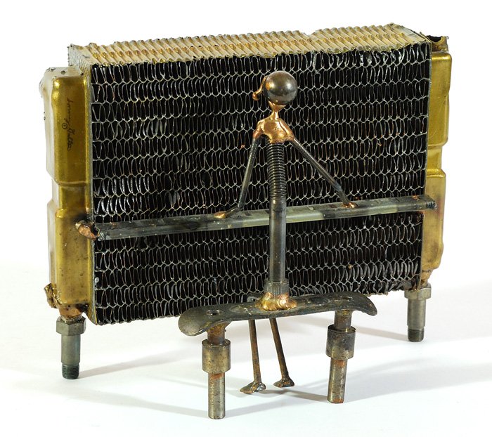 Sonny Dalton Sculpture: Car radiator and found object sculpture of a man playing piano. Signed by the artist. 7.5H x 9.5W x 5D