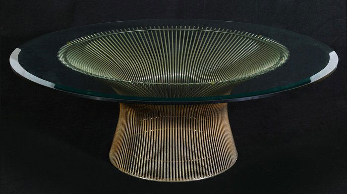 Warren Platner Table: Nickel-plated steel base with beveled round glass top. Includes original rubber protective ring on base. Manufactured by Knoll, 1960. From a private collection. Size: 15H x 42diam.