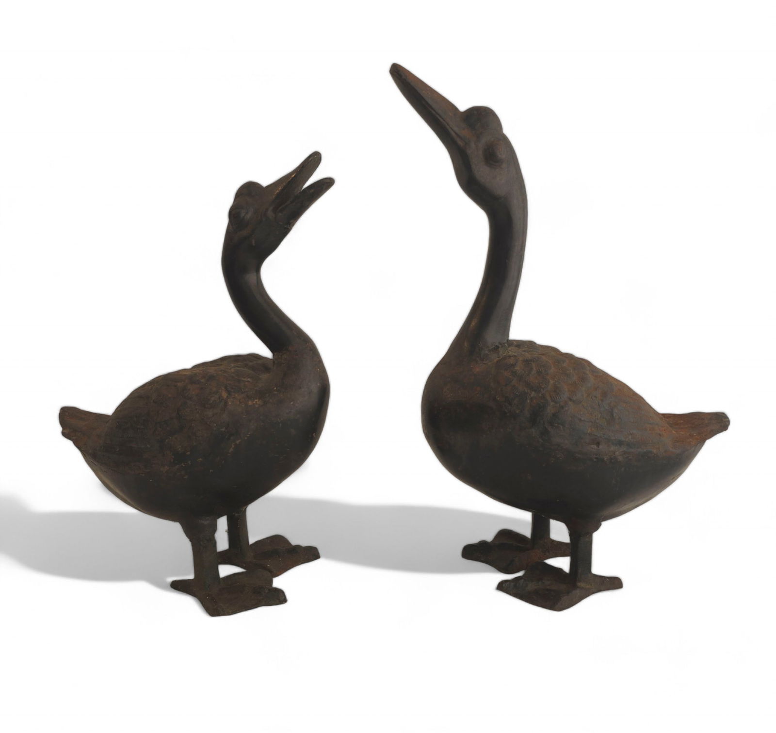 Cast Iron Goose Garden Sculptures or Doorstops: Cast Iron Goose Garden Sculptures or Doorstops. 20th century. 1950s. Larger - 5w x 8 1/2d x 14 1/2h. Smaller - 5w x 8 1/2d x 12 1/2h.