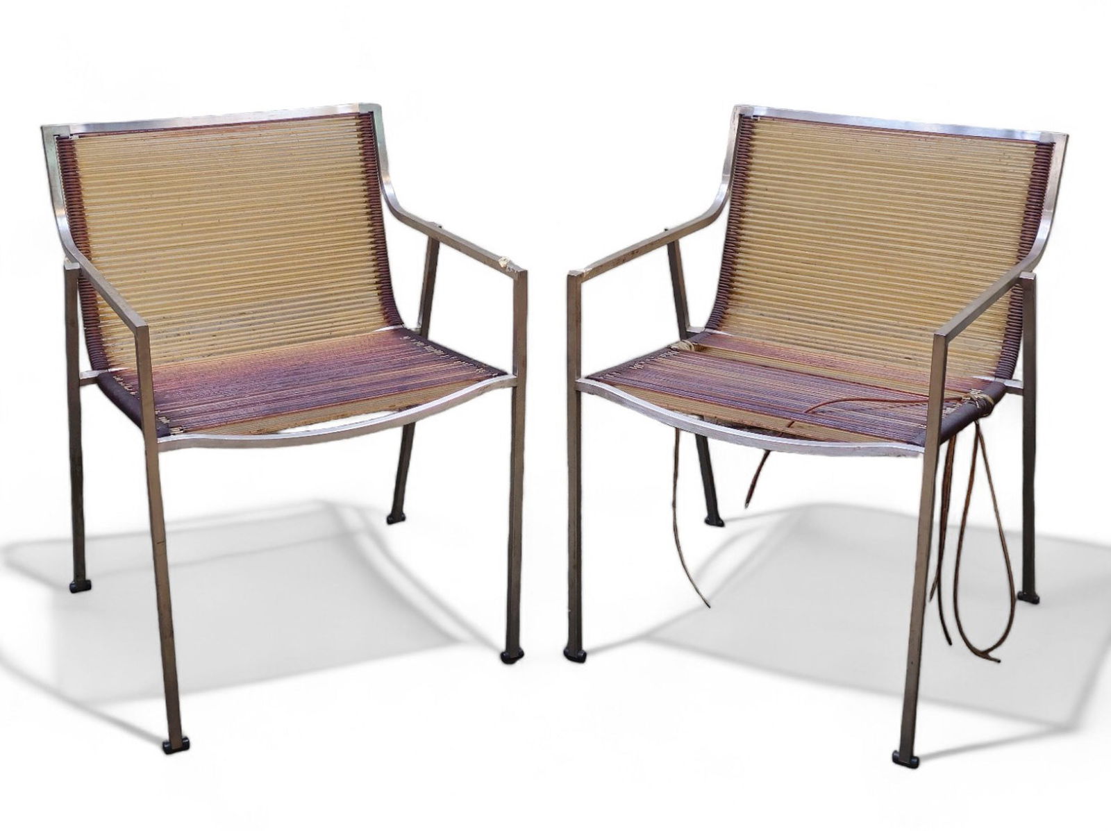 Stefano Gallizioli Armchairs: Stefano Gallizioli Armchairs. Model PO1. Coro, Italy. 1980's. Stainless steel, PVC nylon cords and rubber. 26 3/8w x 29d x 28 3/8h. SH 13 3/4.