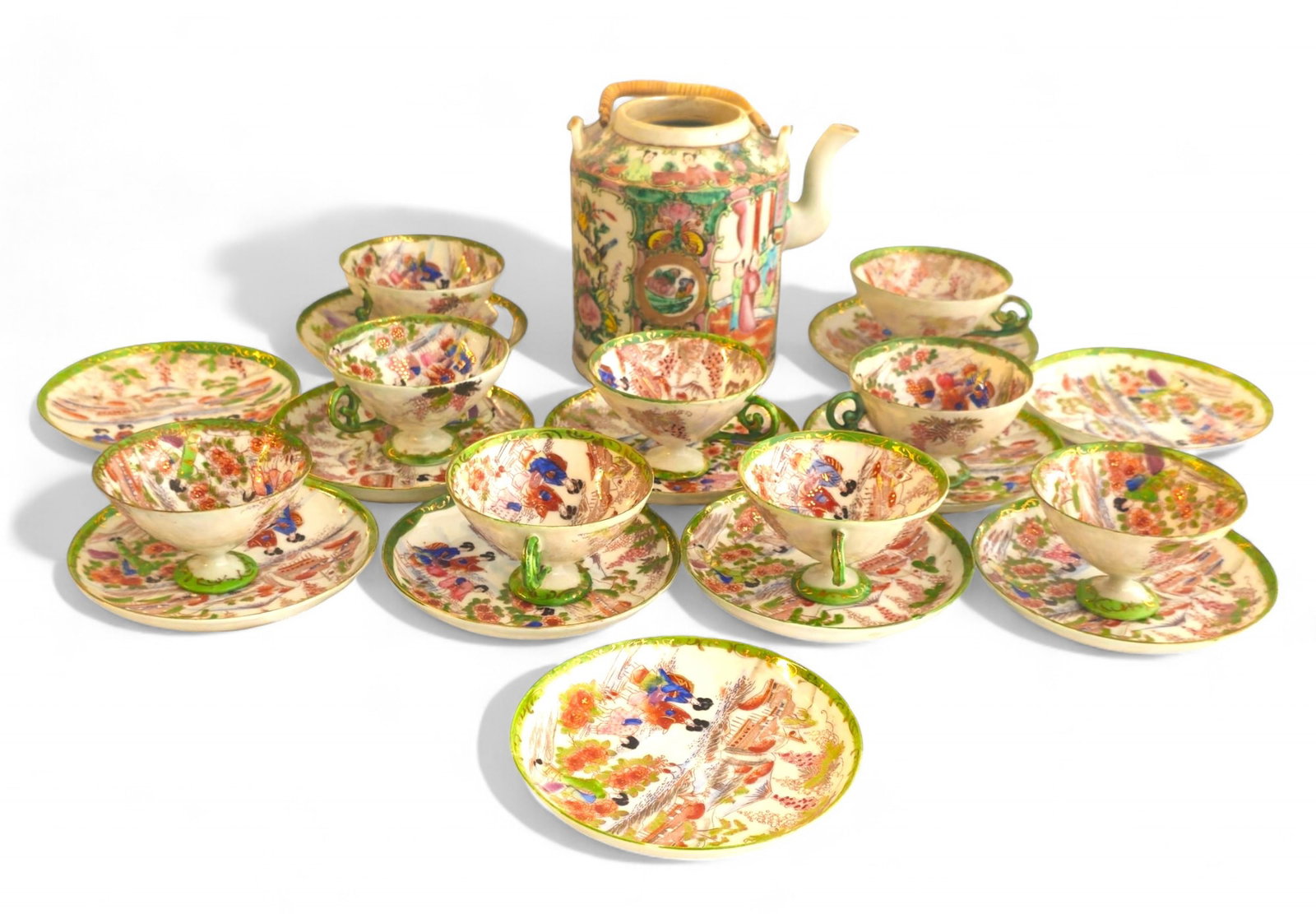 Assembled Rose Medallion Cups & Saucers Plus: Assembled Rose Medallion Cups & Saucers Plus. 9 cups and 12 saucers, early 20th century. Teapot, 19th century. Teapot - 6 1/2w x 5d x 6h. Saucers - 5 1/2dia. Cups - 4 3/8w x 3 3/4d x 2 3/8h.