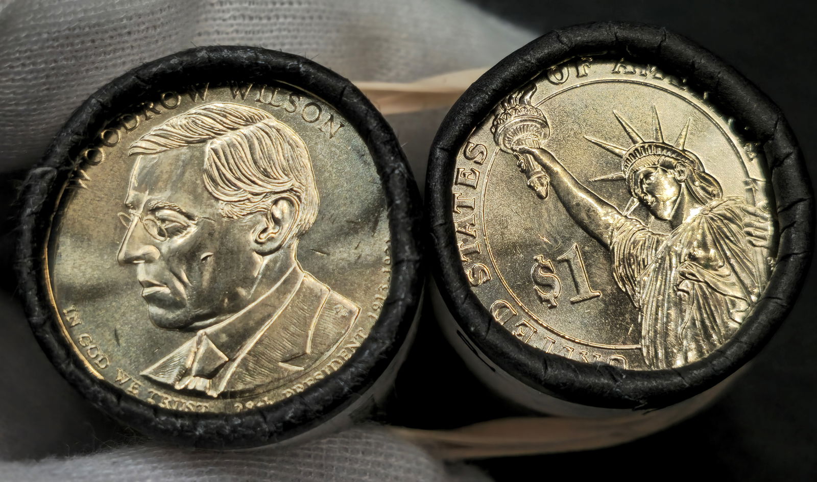 Presidential Dollar U.S. Mint Rolls: (2) U.S. Mint rolls total. (1) Ulysses S. Grant and (1) Woodrow Wilson Dollar $25 rolls. In original U.S. Mint roll.