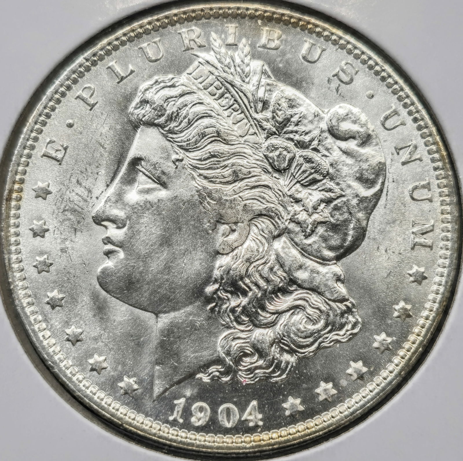 1904-O Morgan Silver Dollar Coin Uncirculated (1 of 2)